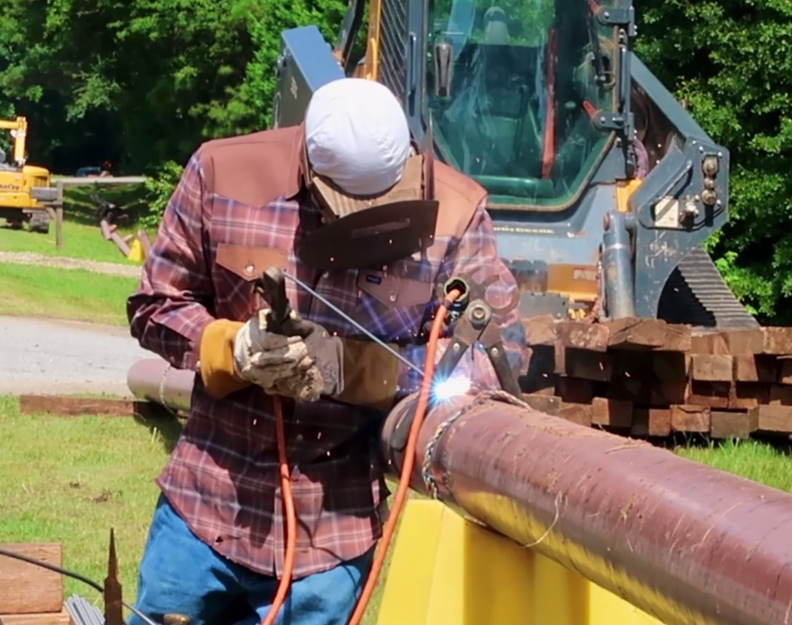 Southern Pipeline employee welding pipe