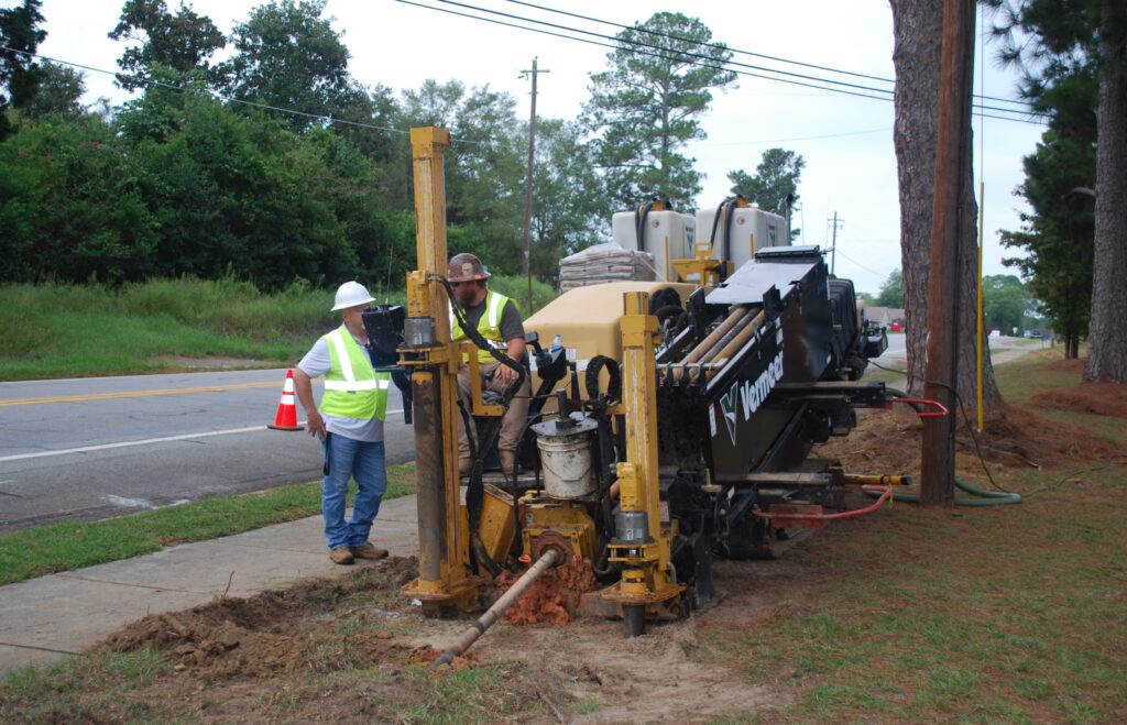 Southern Pipeline employees running prepping for pipeline insert using a trenchless method with a horizontal directional drill